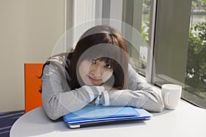 Young woman relaxed in office