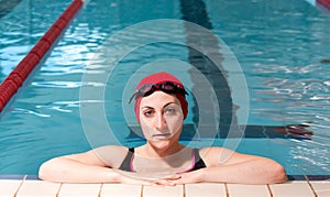 Young woman relaxed on swimming pool.