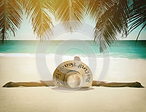 Young woman relaxes on the beach.