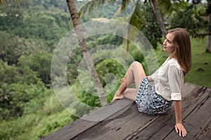 Young woman relaxing on balcony