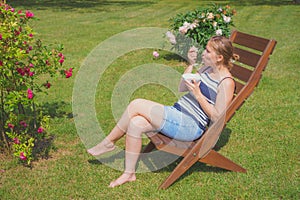 Young woman relaxing and eating ice cream