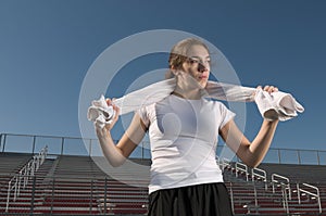 Young woman relaxing after exercising outdoors