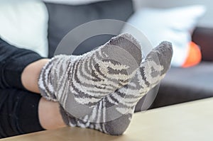 Young woman relaxing with feet up