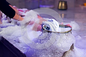 Young woman relaxing in hammam or turkish bath