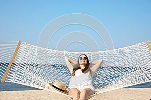 Young woman relaxing in hammock