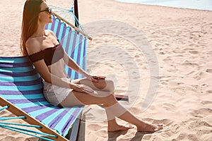 Young woman relaxing in hammock