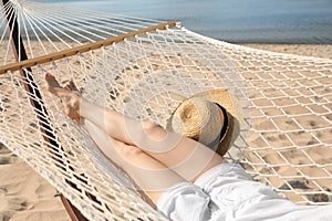 Young woman relaxing in hammock