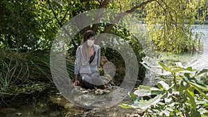 Young woman relaxing in Lagoons of Ruidera Natural Park.