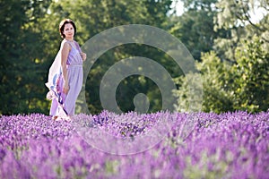 Young woman relaxing in lavender field