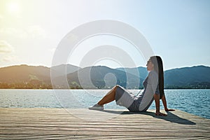 Young woman relaxing on moorage