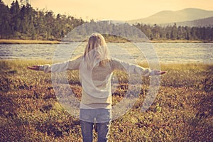 Young Woman relaxing outdoor hand raised Lifestyle