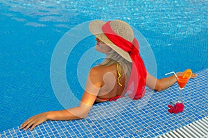 Young woman relaxing at the pool