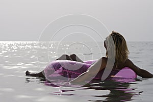 Young woman relaxing in the sea.