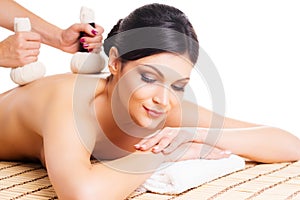 Young woman relaxing on a spa massage procedure