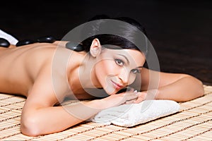 Young woman relaxing on a spa massage procedure