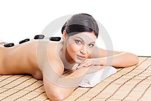 Young woman relaxing on a spa massage procedure