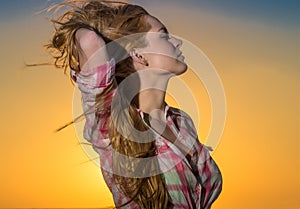 Young woman relaxing at sunset