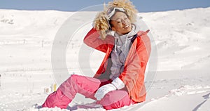 Young woman relaxing in thick winter snow