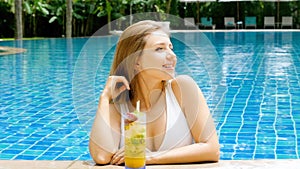 Young woman relaxing in tropical pool. Vacation or travel