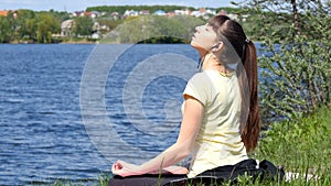 Young woman removing his jacket enjoying sun and warmth.