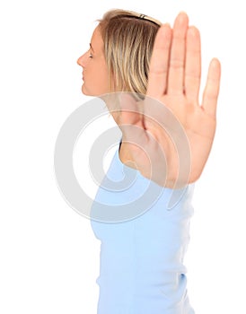Young woman with repelling gesture