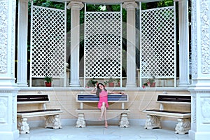 Young woman resting on a bench in a beautiful Park.