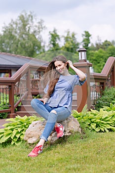 Young woman resting and having fun in the park