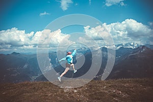 Young woman resting on a mountain hike