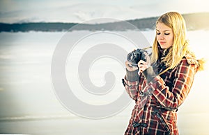 Young Woman with retro photo camera outdoor