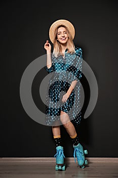 Young woman with retro roller skates