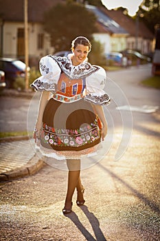 Young woman in a richly decorated ceremonial folk dress