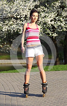 Young woman ride rollerblades photo