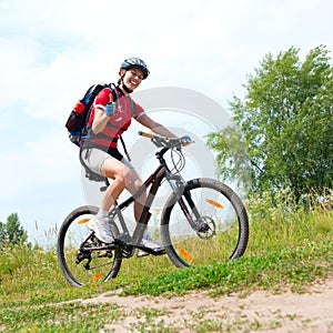 Young Woman riding bicycle