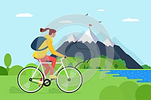 Young woman riding bicycle in mountains. Girl bicyclist tourist with backpack on bike travel in nature. Female cyclist