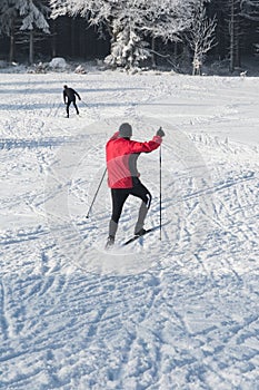 Young woman riding cross-country skiing