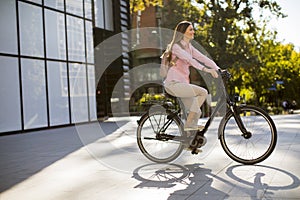 Young woman riding an electric bicycle