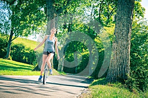 Young Woman Riding Her Unicycle