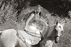 Young woman riding on horse (motion blur)