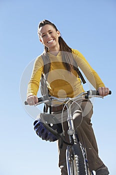 Young Woman Riding Mountain Bike