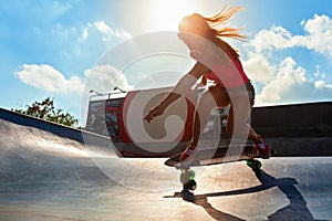 Young woman riding on surf skate