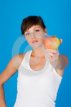 Young woman with ripe apple