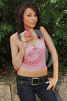 Young woman with ripe apple