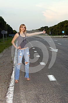 Young woman on the roadside