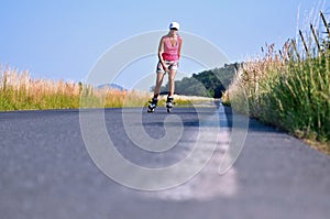 Young woman rollerskating