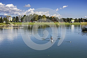 Young woman rowing in boat