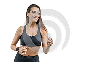 Young woman runner in black sportswear, isolated on white background, copy space