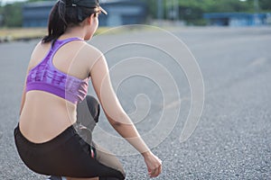 Young woman runner is jogging on the street be running for exercise.