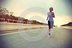 Young woman runner running
