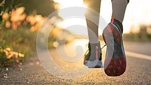 Young woman runner running on city bridge road, Young fitness woman runner athlete running at road