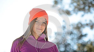 Young Woman Runner Smiling in Beautiful Winter Forest at Sunny Frosty Day. Active Lifestyle and Sport Concept.